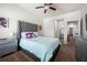 Inviting bedroom with a large window, ceiling fan and carpet flooring at 1570 Ribbon Mill Sw Ln, Mableton, GA 30126