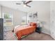 Well-lit bedroom with a comfortable bed, dresser, and large windows at 1570 Ribbon Mill Sw Ln, Mableton, GA 30126