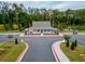 A well-maintained community center with parking, sidewalks, and a playground in the background at 1570 Ribbon Mill Sw Ln, Mableton, GA 30126