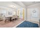Bright and airy dining area with modern lighting, large windows, and stylish decor at 1570 Ribbon Mill Sw Ln, Mableton, GA 30126