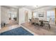 Elegant dining room with a large table, stylish chairs, and bright natural light at 1570 Ribbon Mill Sw Ln, Mableton, GA 30126