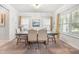 Cozy dining room featuring a modern chandelier, window views, and a neutral color palette at 1570 Ribbon Mill Sw Ln, Mableton, GA 30126
