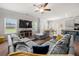 Large living room featuring ample natural light, a ceiling fan, and view of dining and kitchen areas at 1570 Ribbon Mill Sw Ln, Mableton, GA 30126