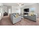 Comfortable living room with a large sofa, neutral color palette, and plenty of natural light at 1570 Ribbon Mill Sw Ln, Mableton, GA 30126