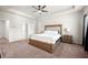Spacious main bedroom with a trey ceiling, natural light, and ensuite bathroom access at 1570 Ribbon Mill Sw Ln, Mableton, GA 30126