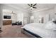 Spacious main bedroom with sitting area, tray ceilings, ceiling fan, and ensuite bathroom at 1570 Ribbon Mill Sw Ln, Mableton, GA 30126