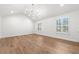 A bright, expansive bedroom featuring hardwood floors and abundant natural light, perfect for a serene retreat at 650 Moores Mill Nw Rd # 1, Atlanta, GA 30327