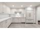 Spacious kitchen boasts stylish white cabinetry, granite countertops, and stainless steel appliances, exuding modern elegance at 650 Moores Mill Nw Rd # 1, Atlanta, GA 30327