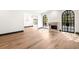 Sun-filled room with hardwood floors and fireplace next to black grid windows at 650 Moores Mill Nw Rd # 1, Atlanta, GA 30327