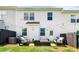 Relaxing backyard featuring a seating area, fire pit, string lights, and privacy fence for outdoor enjoyment at 1316 Willamette Way, Marietta, GA 30008