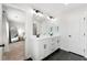 Stylish bathroom with double sinks, modern lighting, and access to the bedroom at 1316 Willamette Way, Marietta, GA 30008