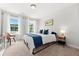 Sun-filled bedroom with plush carpet, modern decor, and a large window overlooking the serene outdoors at 1316 Willamette Way, Marietta, GA 30008