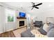 Bright living room with a stone fireplace, neutral color palette, and hardwood flooring at 1316 Willamette Way, Marietta, GA 30008