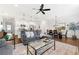 Open-concept living room and kitchen with modern appliances and hardwood floors, perfect for entertaining at 1316 Willamette Way, Marietta, GA 30008