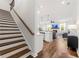 Bright, open floor plan featuring wood floors, a modern kitchen, and a cozy living area with fireplace at 1316 Willamette Way, Marietta, GA 30008