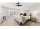 A spacious primary bedroom with lots of natural light and a ceiling fan, creating a relaxing ambiance at 1316 Willamette Way, Marietta, GA 30008
