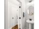 Clean and stylish powder room with pedestal sink and modern fixtures at 1316 Willamette Way, Marietta, GA 30008
