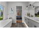 Bathroom with soaking tub, shower, and view into main bedroom at 185 Central Ave, Fayetteville, GA 30214