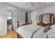 Bright bedroom boasts wood floors, neutral walls, and backyard views at 185 Central Ave, Fayetteville, GA 30214