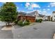Charming townhomes boast brick and neutral exteriors, green landscaping, and two-car garages at 185 Central Ave, Fayetteville, GA 30214