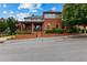Attractive two-story home with a brick facade, front porch, and well-maintained landscaping at 185 Central Ave, Fayetteville, GA 30214