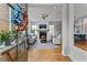 Inviting foyer leads to a beautifully decorated living room with a fireplace, neutral furniture, and abundant natural light at 185 Central Ave, Fayetteville, GA 30214
