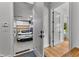 Attached garage with epoxy flooring, featuring a white sports car and access to interior rooms at 185 Central Ave, Fayetteville, GA 30214