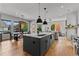 Spacious kitchen with large island, modern lighting, and open floor plan, perfect for entertaining at 185 Central Ave, Fayetteville, GA 30214