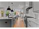 Modern kitchen featuring a large island, open floor plan, and stylish gray and white color scheme at 185 Central Ave, Fayetteville, GA 30214