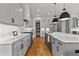 Bright kitchen with white cabinets, stainless steel appliances and a center island with bar stools at 185 Central Ave, Fayetteville, GA 30214