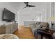 Stylish living room with hardwood floors, modern ceiling fan, and comfortable sofa at 185 Central Ave, Fayetteville, GA 30214