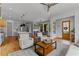 Open living space with kitchen, dining, and living areas, featuring neutral tones and wood floors at 185 Central Ave, Fayetteville, GA 30214