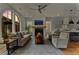 Cozy living room with fireplace, comfortable seating, and arched windows at 185 Central Ave, Fayetteville, GA 30214