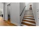 Bright foyer featuring a staircase with wood treads and white risers, leading to the upper level at 185 Central Ave, Fayetteville, GA 30214