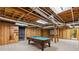 Spacious basement with a billiards table and large movie screen, perfect for entertaining at 220 Hollyridge Dr, Roswell, GA 30076