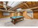 Finished basement featuring a billiards table, a large movie screen, and a walkout to the yard at 220 Hollyridge Dr, Roswell, GA 30076