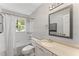 Bright bathroom with a shower-tub, vanity, and neutral color scheme at 220 Hollyridge Dr, Roswell, GA 30076