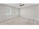 Bedroom with neutral carpet, bright windows, and a ceiling fan at 220 Hollyridge Dr, Roswell, GA 30076
