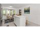 Bright kitchen featuring white cabinetry, a center island, and a breakfast nook with outdoor access at 220 Hollyridge Dr, Roswell, GA 30076