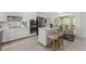 Modern kitchen with white cabinets, stainless steel appliances, and a center island at 220 Hollyridge Dr, Roswell, GA 30076