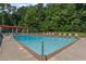 Sparkling pool with plenty of lounge chairs at 220 Hollyridge Dr, Roswell, GA 30076