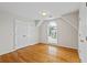 This bedroom has a large window, hardwood floors, and a double door closet at 2873 Hilton Nw Cir, Kennesaw, GA 30152
