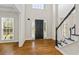 Front entryway boasting hardwood floors and a dark front door framed by sidelights at 2873 Hilton Nw Cir, Kennesaw, GA 30152