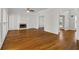 Living room featuring hardwood floors, fireplace, and multiple entryways perfect for entertaining or relaxing at 2873 Hilton Nw Cir, Kennesaw, GA 30152