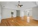Large main bedroom with hardwood floors, tray ceiling, and multiple windows at 2873 Hilton Nw Cir, Kennesaw, GA 30152