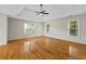 This large main bedroom features hardwood floors, tray ceiling, and natural light at 2873 Hilton Nw Cir, Kennesaw, GA 30152