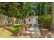 Backyard shed with an adjacent planting bed and a stone pathway at 2873 Hilton Nw Cir, Kennesaw, GA 30152
