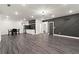 Basement features hardwood floors, a bar, and a modern decorative wall at 2922 Parkridge Ne Dr, Brookhaven, GA 30319