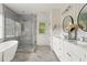 Spa-like bathroom with walk-in shower, soaking tub, double vanity, and elegant finishes at 2922 Parkridge Ne Dr, Brookhaven, GA 30319