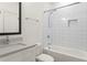 Bathroom with white subway tile, modern fixtures, and a shower-tub combination at 2922 Parkridge Ne Dr, Brookhaven, GA 30319